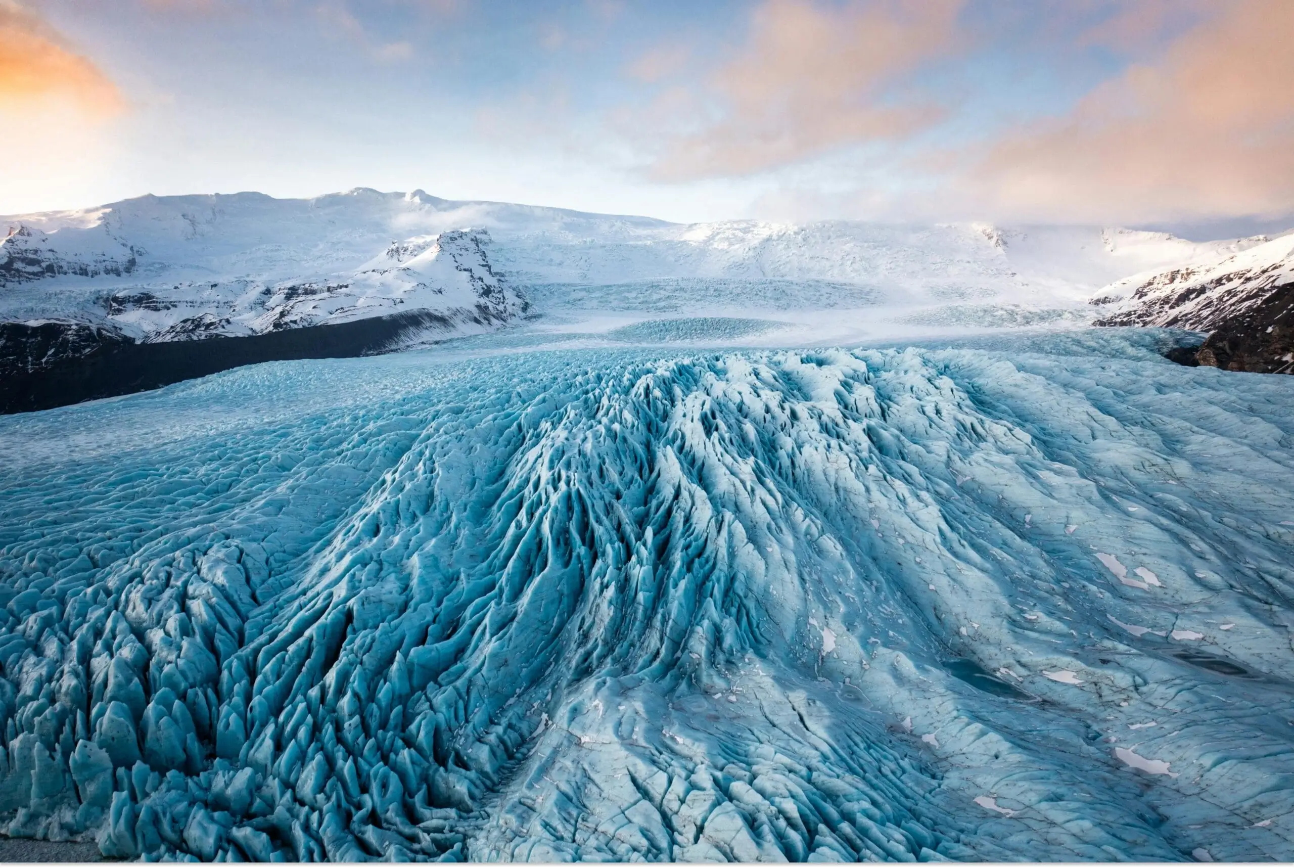 Massive glacier surrounded by icy waters