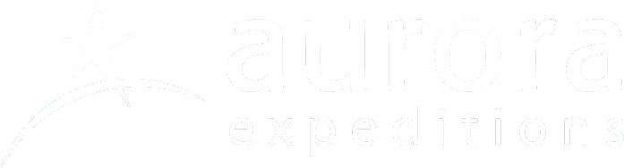White Aurora Expeditions star icon and wordmark logo on a dark background.