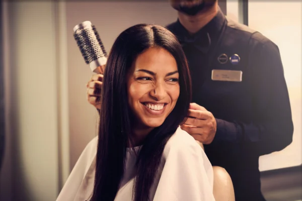 Guest enjoying a professional hair styling treatment at the P&O Cruises onboard salon.