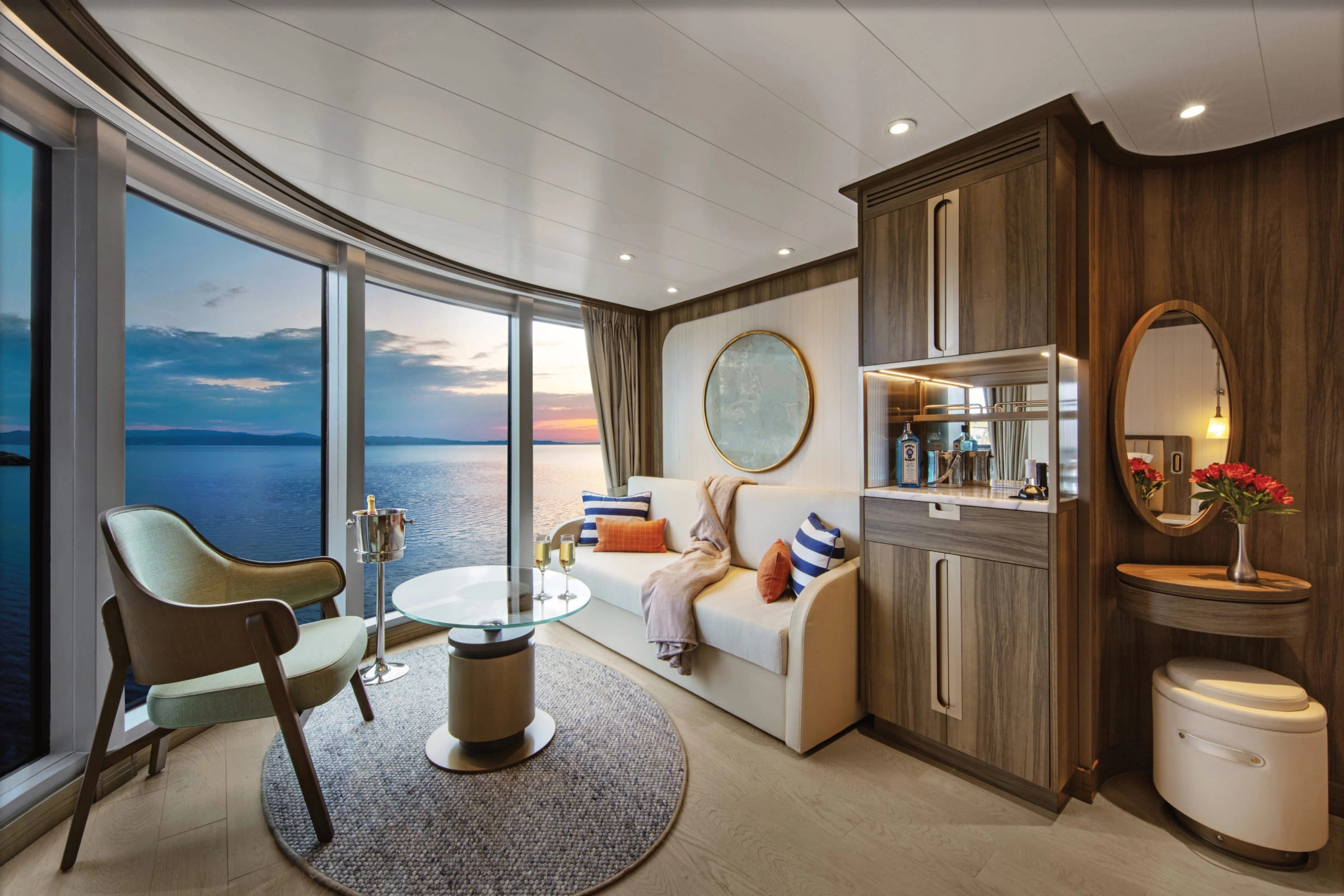 Modern all-ocean front suite with a private balcony on Seabourn.