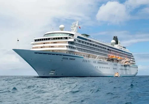 Crystal Symphony luxury cruise ship sailing across the open ocean.
