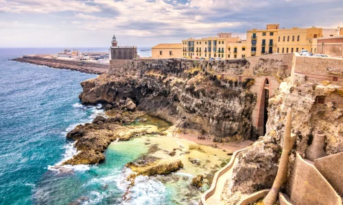 Coastal destination featured on a Crystal Cruises itinerary, showcasing scenic cliffs, turquoise waters, and luxury travel experiences.
